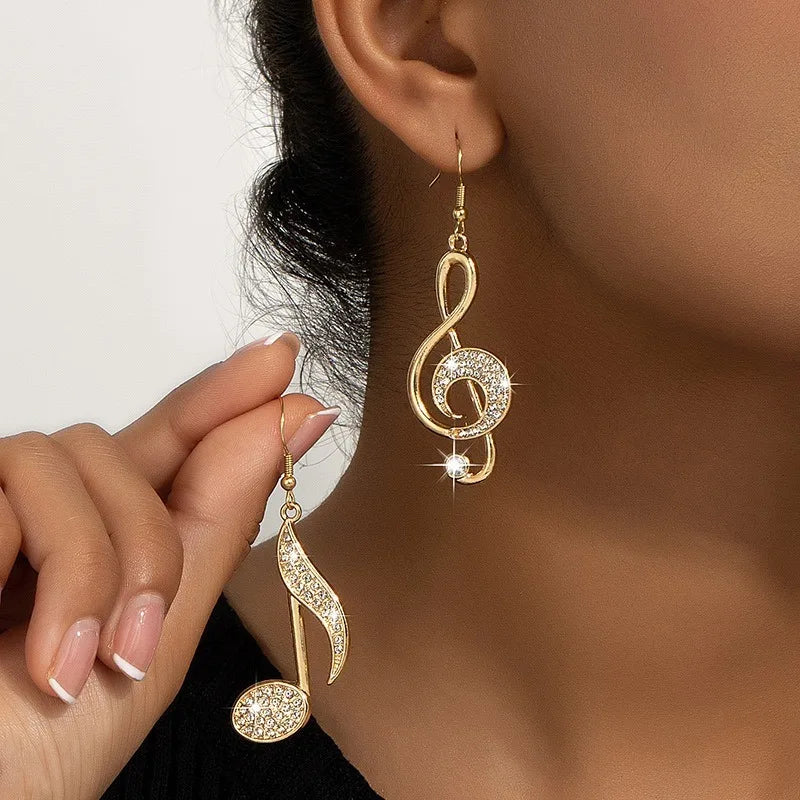 Exquisito diseño de símbolo musical dorado, pendientes de mujer con diamantes de imitación brillantes, regalo para entusiastas de la música navideña