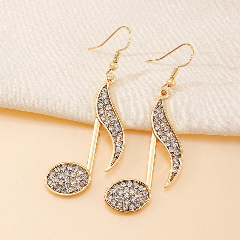 Exquisito diseño de símbolo musical dorado, pendientes de mujer con diamantes de imitación brillantes, regalo para entusiastas de la música navideña