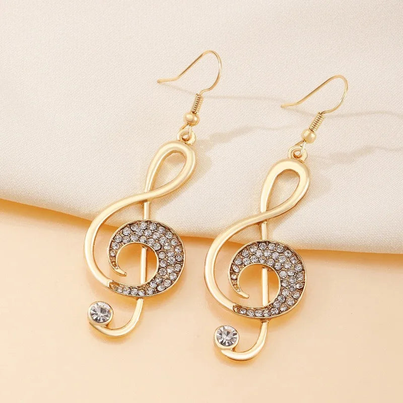 Exquisito diseño de símbolo musical dorado, pendientes de mujer con diamantes de imitación brillantes, regalo para entusiastas de la música navideña